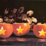 Artesanía para hacer portavelas de Halloween con naranjas